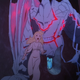 Maquia runs from a crazed Renato (dragon-like creature) with Red-Eye, some kind of rabies-like fatal disease.